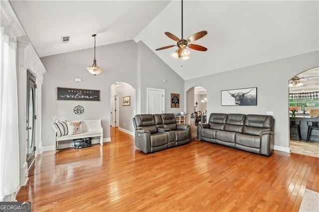 698 Jefferson Hwy, Winder, GA 30680 - living area featuring a ceiling fan, arched walkways, light wood finished floors, and high vaulted ceiling