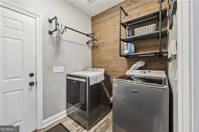698 Jefferson Hwy, Winder, GA 30680 - washroom with independent washer and dryer and wooden walls