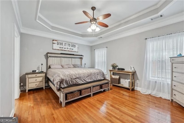 698 Jefferson Hwy, Winder, GA 30680 - bedroom with a raised ceiling, wood finished floors, ornamental molding, and a ceiling fan