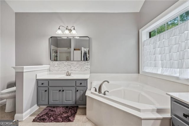 698 Jefferson Hwy, Winder, GA 30680 - full bathroom with vanity, a garden tub, backsplash, and tile patterned floors