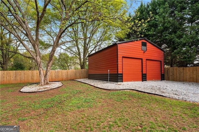 698 Jefferson Hwy, Winder, GA 30680 - fenced yard featuring an outbuilding and a garage