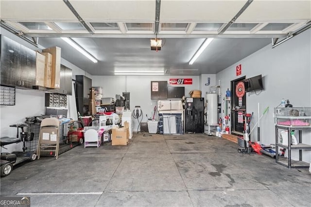 698 Jefferson Hwy, Winder, GA 30680 - garage with water heater and a garage door opener