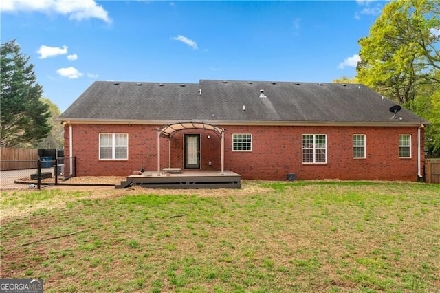 698 Jefferson Hwy, Winder, GA 30680 - back of house with a fenced backyard, a pergola, a wooden deck, and brick siding