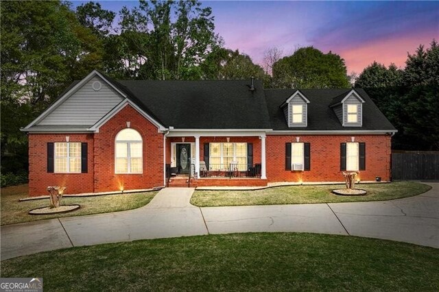 698 Jefferson Hwy, Winder, GA 30680 - view of front of house with brick siding, a front lawn, and concrete driveway