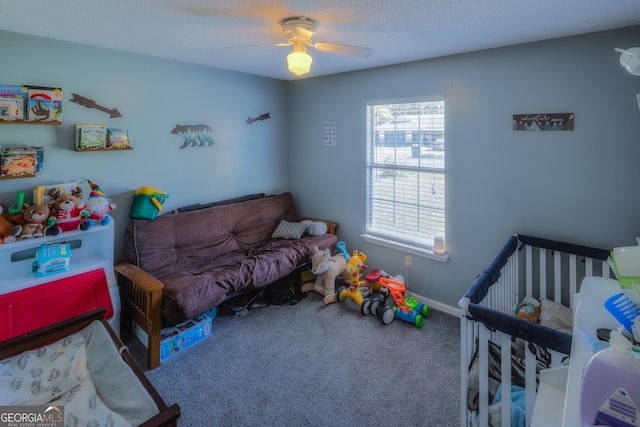 carpeted bedroom with ceiling fan and baseboards