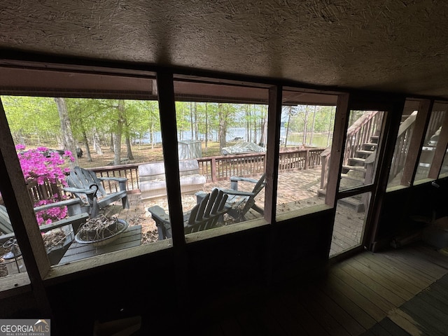 interior space with a wooden deck and stairway