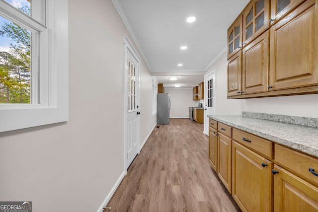 hall featuring crown molding, recessed lighting, baseboards, and light wood-type flooring