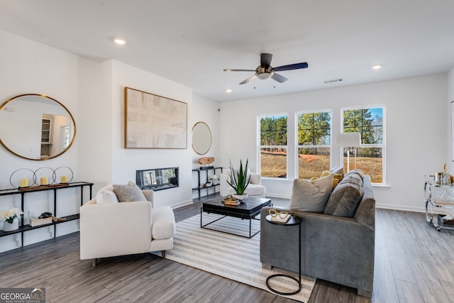 living area featuring recessed lighting, wood finished floors, and ceiling fan