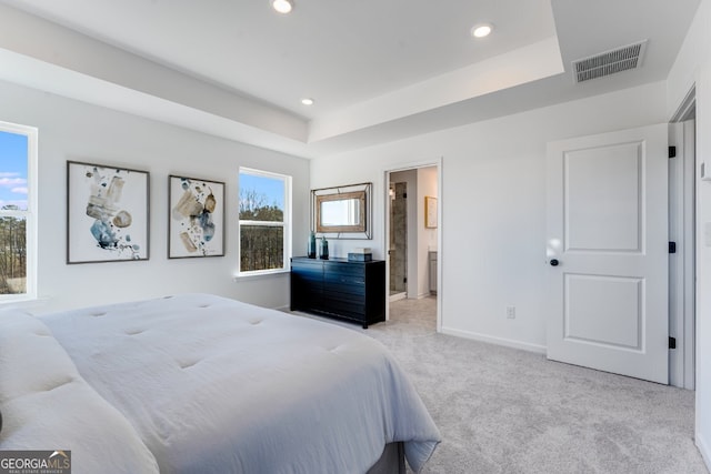 bedroom featuring a tray ceiling, visible vents, recessed lighting, carpet flooring, and baseboards