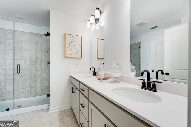 bathroom featuring a sink, visible vents, and a shower stall