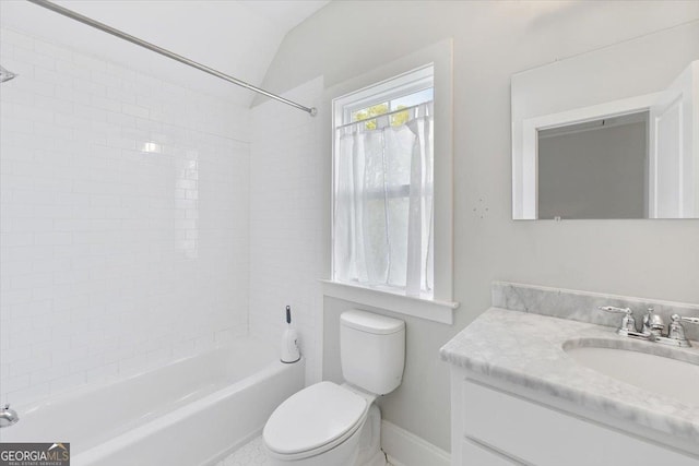 full bathroom with toilet, vanity, vaulted ceiling, and shower / bathtub combination