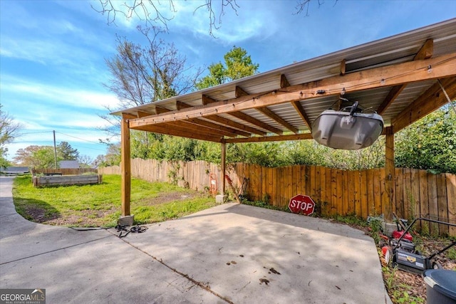 view of patio featuring fence