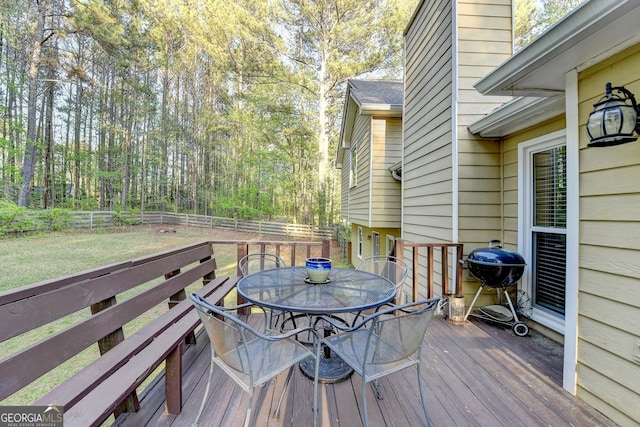 6040 Carriage Dr, Cumming, GA 30028 - wooden deck featuring a grill, outdoor dining space, fence, and a lawn