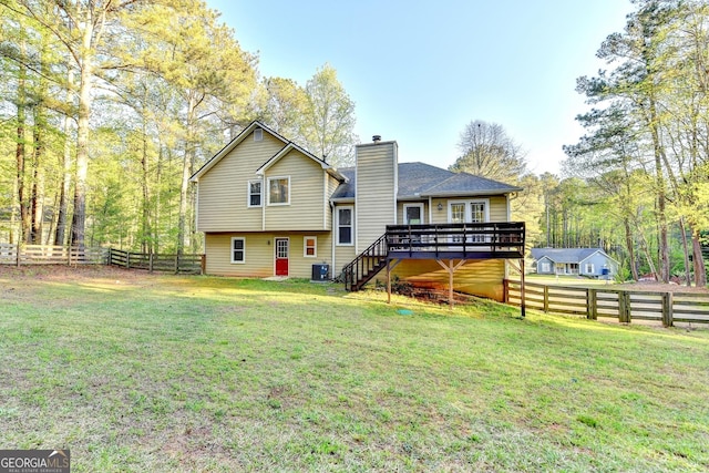6040 Carriage Dr, Cumming, GA 30028 - rear view of property featuring a yard, a chimney, fence private yard, and stairs