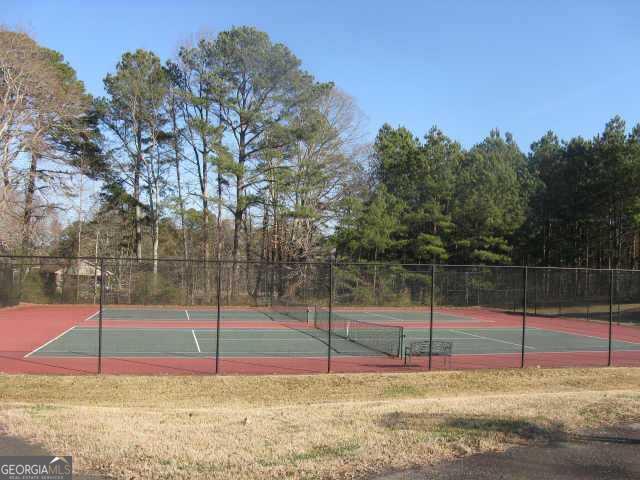 6040 Carriage Dr, Cumming, GA 30028 - view of tennis court featuring fence
