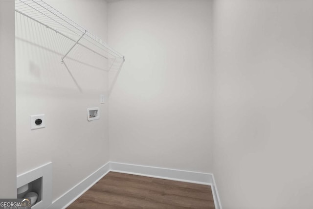 washroom featuring laundry area, dark wood finished floors, electric dryer hookup, washer hookup, and baseboards