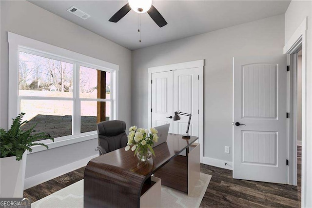 office featuring visible vents, ceiling fan, wood finished floors, and baseboards
