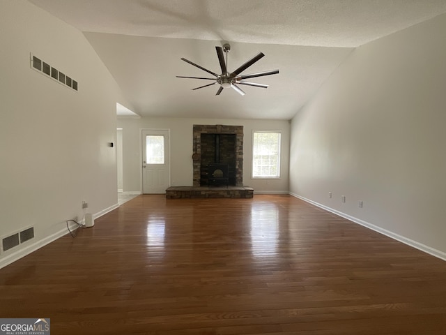 unfurnished living room with visible vents, ceiling fan, and vaulted ceiling