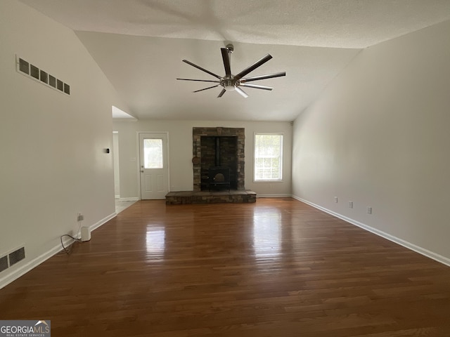 unfurnished living room featuring ceiling fan, visible vents, and vaulted ceiling