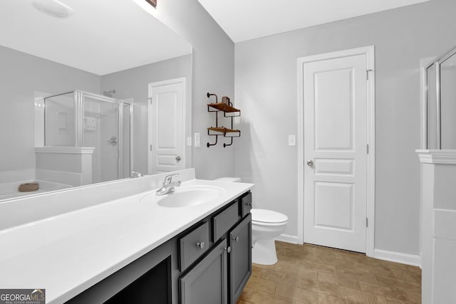 6330 Elmshorn Way, Alpharetta, GA 30004 - full bathroom featuring toilet, a shower stall, vanity, and baseboards