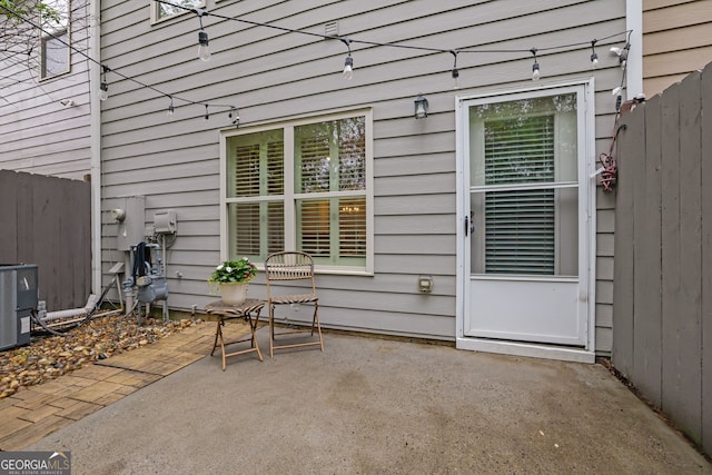 6330 Elmshorn Way, Alpharetta, GA 30004 - view of patio / terrace featuring central AC unit and fence