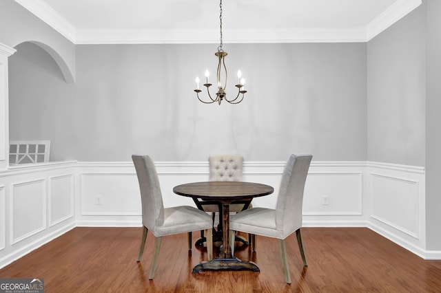 6330 Elmshorn Way, Alpharetta, GA 30004 - dining room featuring a chandelier, wainscoting, crown molding, and wood finished floors