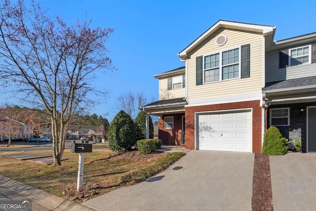 view of front facade featuring brick siding, driveway, and an attached garage