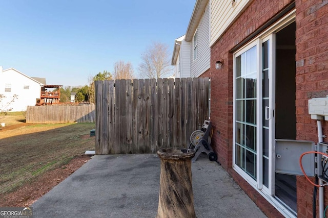 view of patio featuring fence