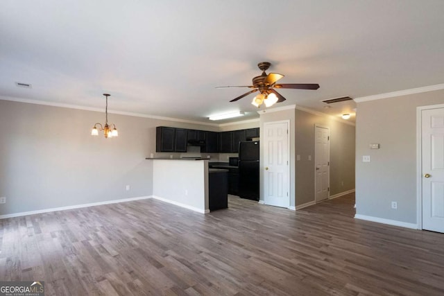kitchen with open floor plan, dark wood-style floors, ceiling fan with notable chandelier, and freestanding refrigerator