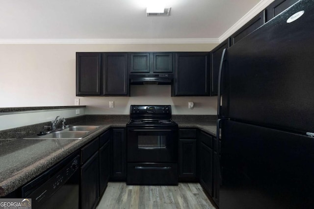 kitchen with crown molding, black appliances, under cabinet range hood, visible vents, and a sink