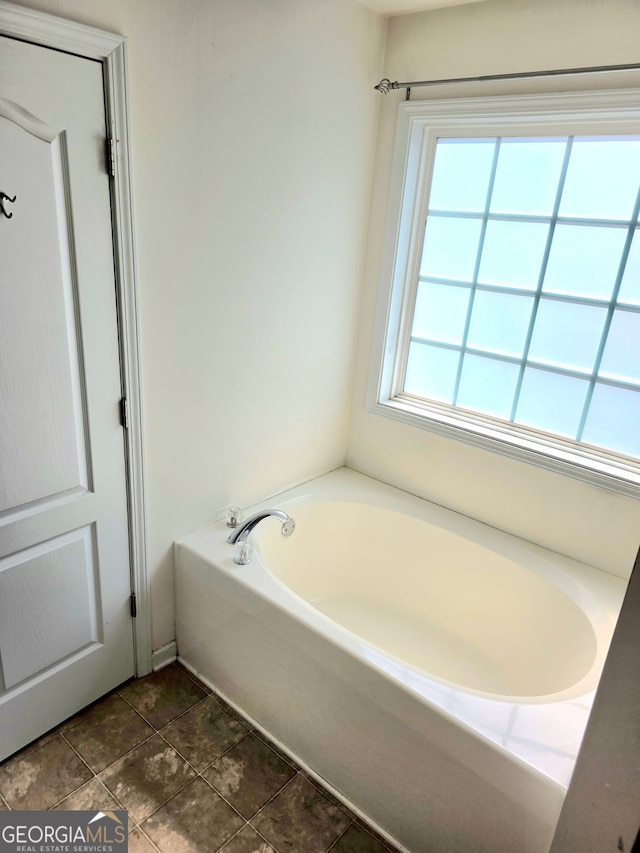 bathroom with a garden tub