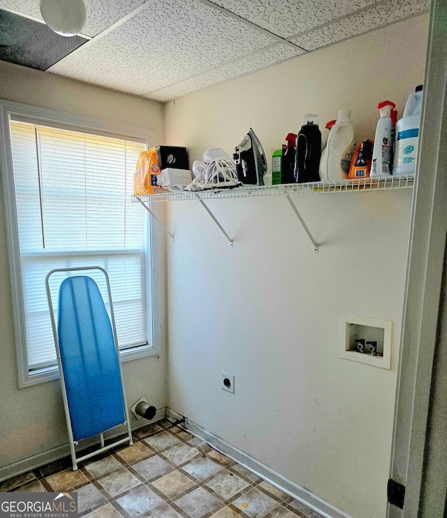 laundry area with laundry area, hookup for a washing machine, electric dryer hookup, and plenty of natural light