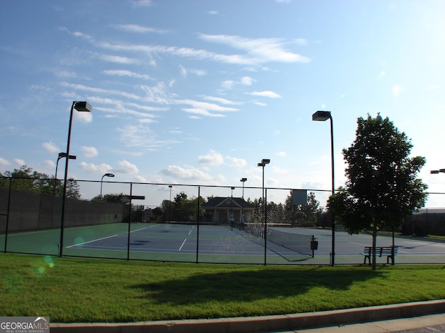 5224 Brendlynn Dr, Suwanee, GA 30024 - view of tennis court with a yard and fence