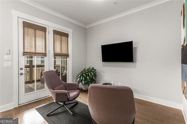 111 Brighton Blvd, Woodstock, GA 30188 - living area with crown molding, wood finished floors, and baseboards