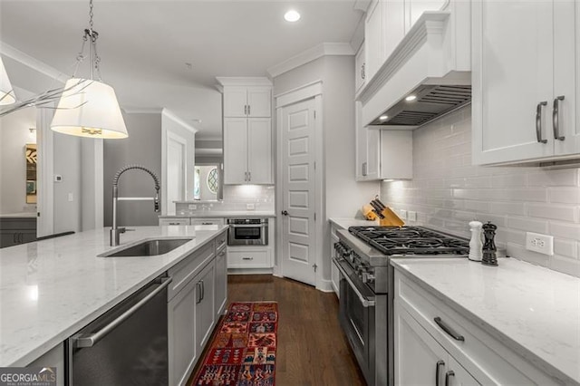 111 Brighton Blvd, Woodstock, GA 30188 - kitchen with custom exhaust hood, a sink, appliances with stainless steel finishes, dark wood-style floors, and white cabinetry