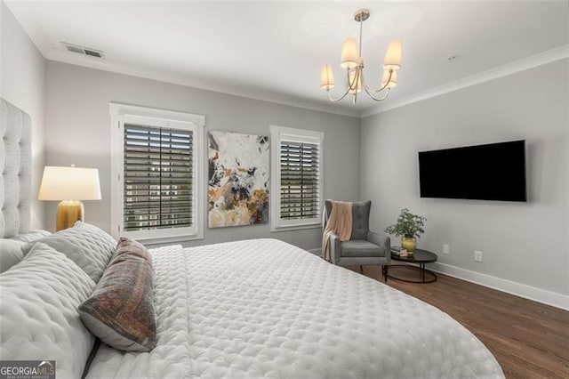 111 Brighton Blvd, Woodstock, GA 30188 - bedroom with visible vents, baseboards, an inviting chandelier, ornamental molding, and wood finished floors