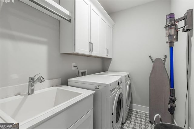111 Brighton Blvd, Woodstock, GA 30188 - laundry room with a sink, independent washer and dryer, cabinet space, and baseboards