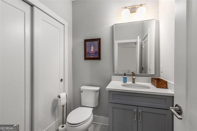 111 Brighton Blvd, Woodstock, GA 30188 - bathroom with vanity, baseboards, and toilet