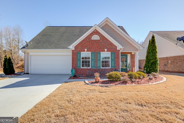 view of front of house with brick siding, a garage, driveway, roof with shingles, and a front yard