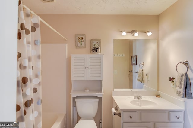 bathroom with shower / bath combo with shower curtain, vanity, toilet, and visible vents