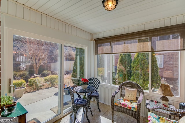 sunroom featuring tile patterned flooring