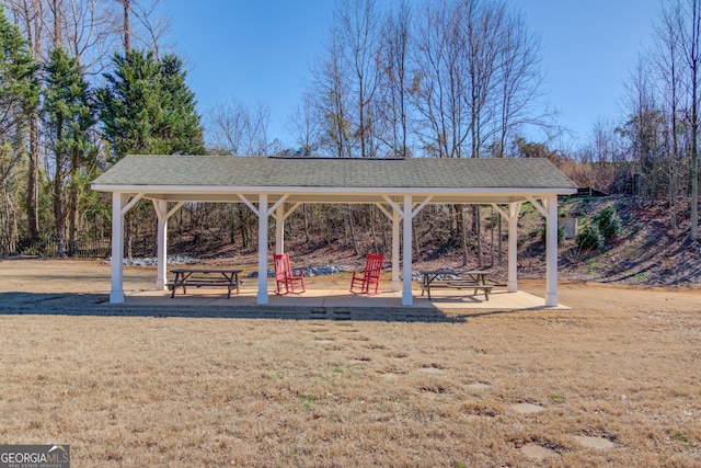 view of home's community with a lawn and a gazebo