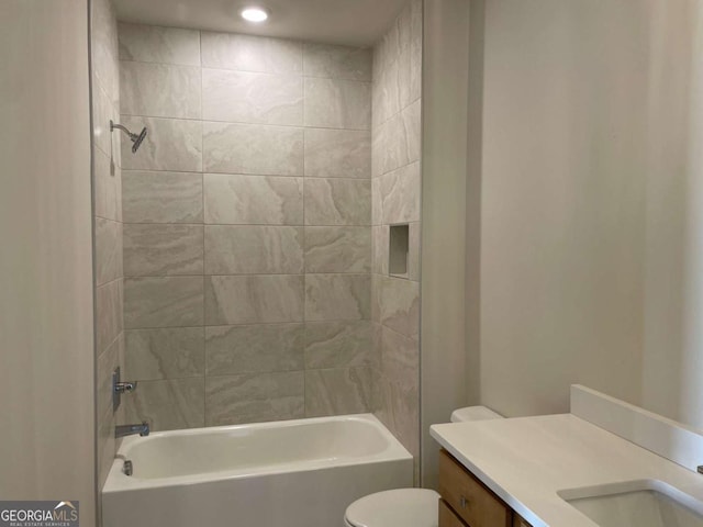full bathroom featuring vanity, shower / tub combination, and toilet