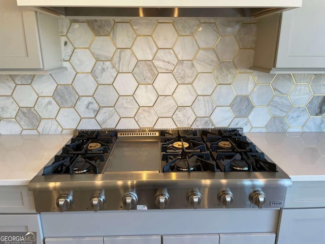 room details featuring stainless steel gas cooktop and tasteful backsplash