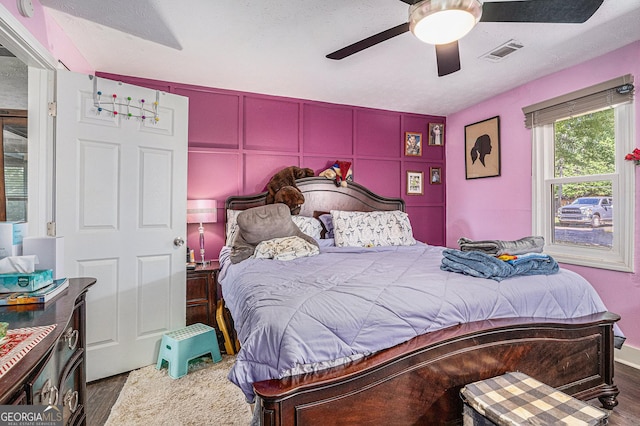 bedroom with wood finished floors and a ceiling fan