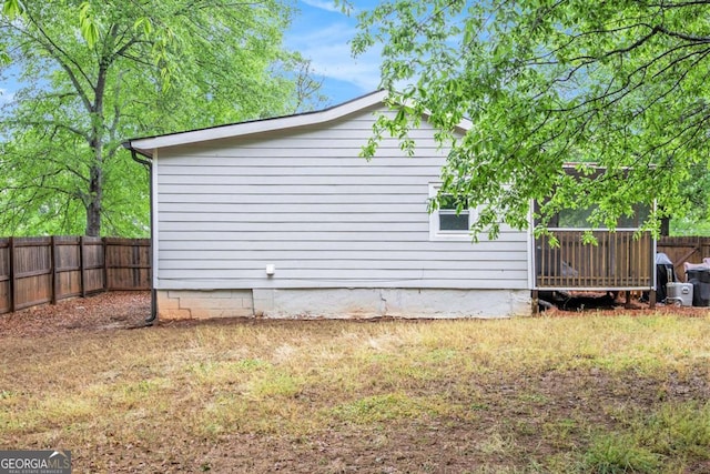 view of side of property featuring a fenced backyard