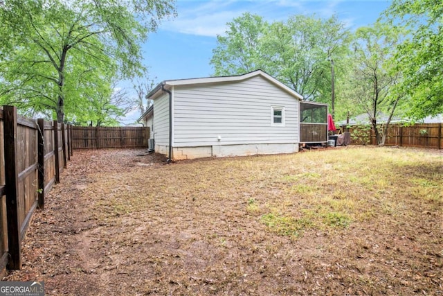 view of yard with a sunroom