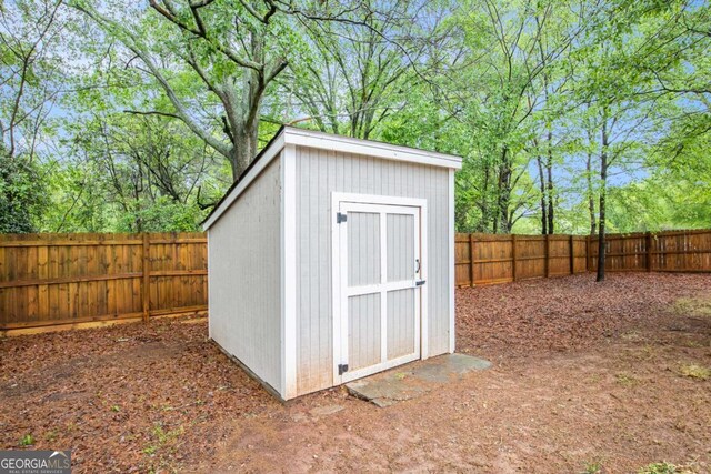 view of shed featuring a fenced backyard