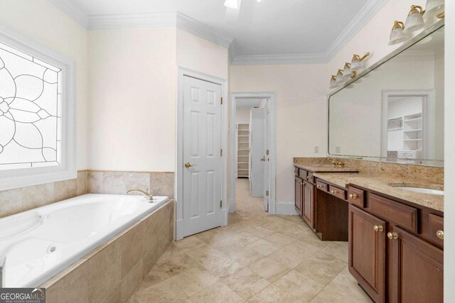 full bathroom featuring double vanity, ornamental molding, a walk in closet, a bath, and a sink