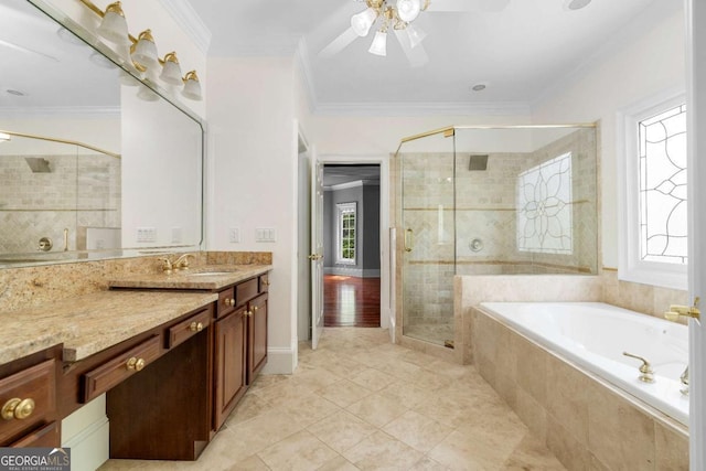 full bathroom with crown molding, a garden tub, a shower stall, vanity, and a ceiling fan